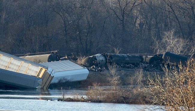 Train cars lie overturned outside of Alma Wis. after derailing on Saturday Nov. 7 2015. BNSF Railway said multiple tanker cars leaked ethanol into the Mississippi River on Saturday