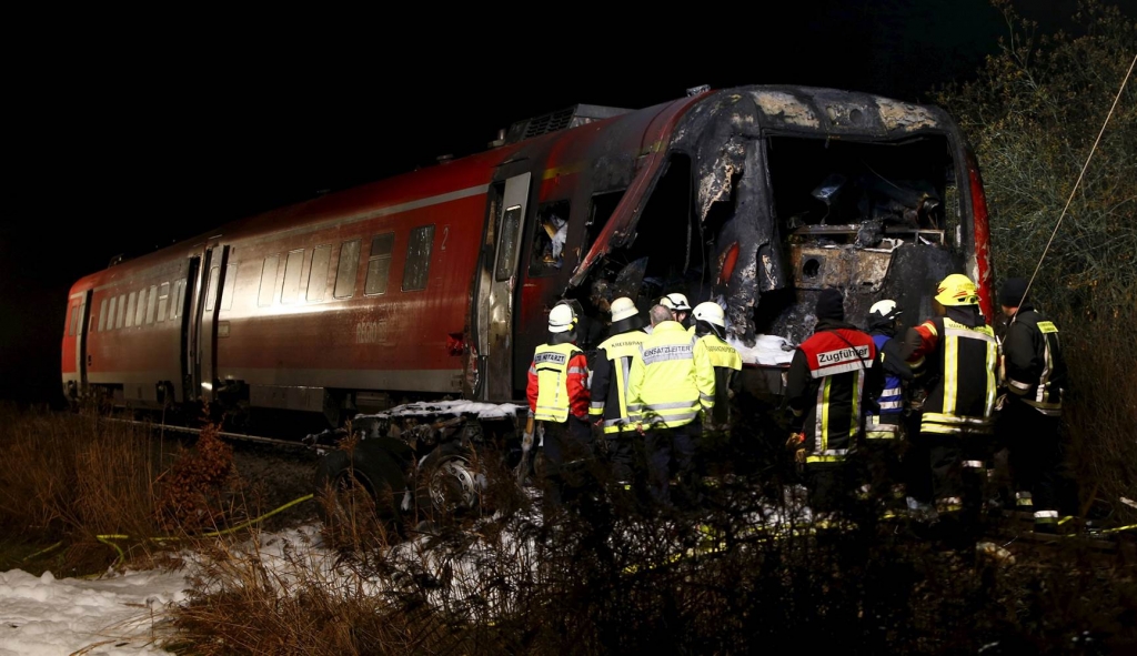 Image Firefighters look for the train driver