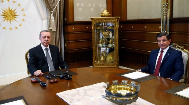 Turkish presidential press shows Turkish President Recep Tayyip Erdogan meeting with Turkish Prime Minister Ahmet Davutoglu at the presidential palace in Ankara