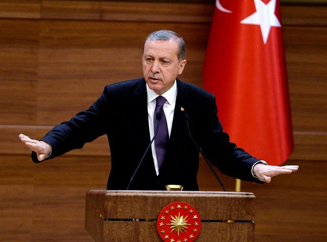 Turkish President Recep Tayyip Erdogan delivers a speech during the mukhtars meeting at the presidential palace in Ankara