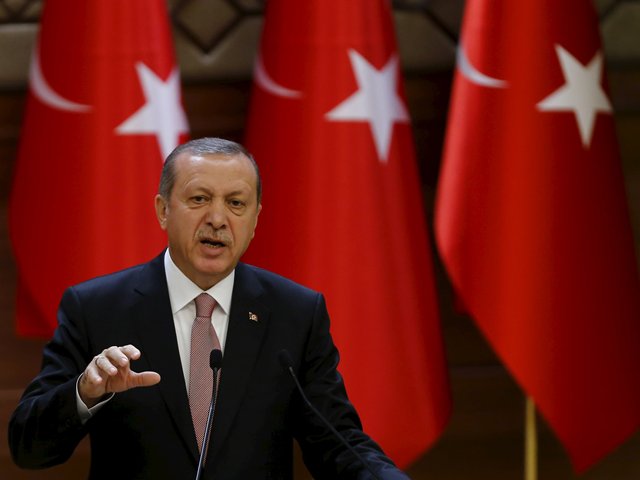 Turkish President Tayyip Erdogan makes a speech during his meeting with mukhtars at the Presidential Palace in Ankara Turkey