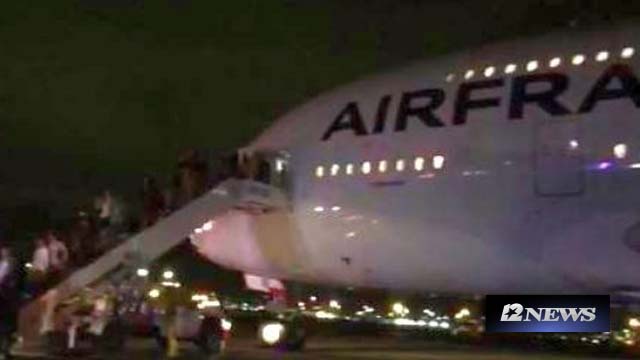 Passengers exit Air France flight 65 from Los Angeles to Paris after an emergency landing in Salt Lake City Nov. 17 2015