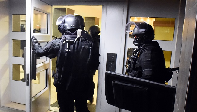 Anti terrorism police officers enter a building during a raid in the Mirail district in Toulouse southwestern France Monday Nov. 16 2015. France's Prime Minister Manuel Valls says there have been 150 police raids overnight in the country. (AP Pho