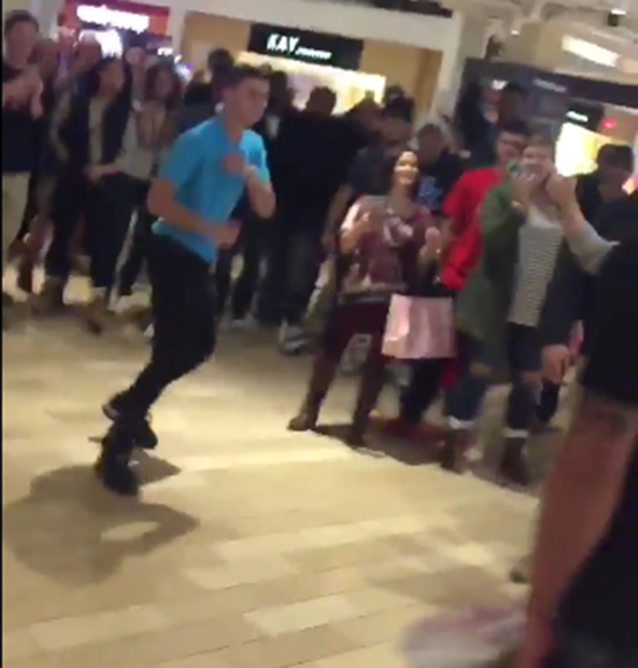 Two men start to fight in a shopping centre in the US during Black Friday sales