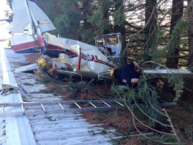 Plane crashes on top of shop building 2 men rescued