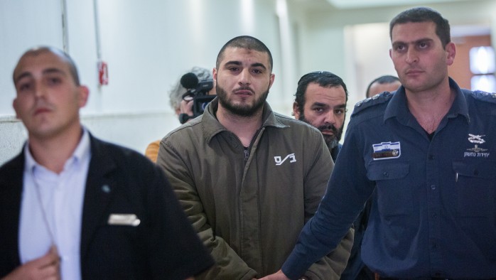 Musa Ajlouni is escorted by Israeli prison officers as he arrives to his sentencing hearing at the District Court in Jerusalem