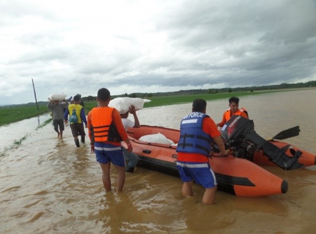 Philippine Air Force a Philippine Air Force rescue team uses rubber boats to distribute relief goods in Isabela province northern Philippines on Sunday Oct. 18 2015. Slow-moving Typhoon Koppu weakened after blowing ashore