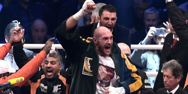 Tyson Fury celebrates his world title triumph