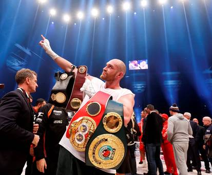 Tyson Fury celebrates winning the fight