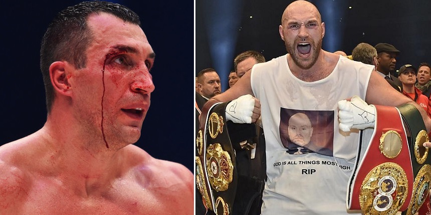 Britain's new world champion Tyson Fury celebrates with the WBA IBF WBO and IBO belts after winning the world heavyweight title fight against Wladimir Klitschko in the Esprit Arena in Duesseldorf western Germany Sunday Nov. 29 2015. (AP