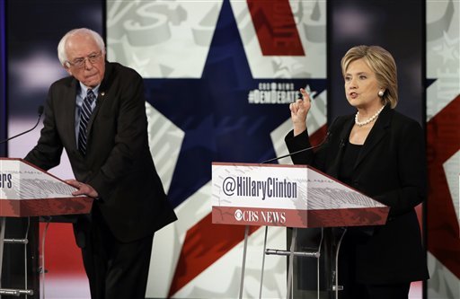 Hillary Rodham Clinton right makes a point as Bernie Sanders listens during a Democratic presidential primary debate in Des Moines Iowa. Clinton and Sanders are outlining the steps on Nov. 19 they would take to combat the