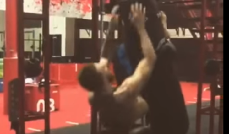 Conor Mc Gregor dominates these sit-ups while hanging off a punching bag