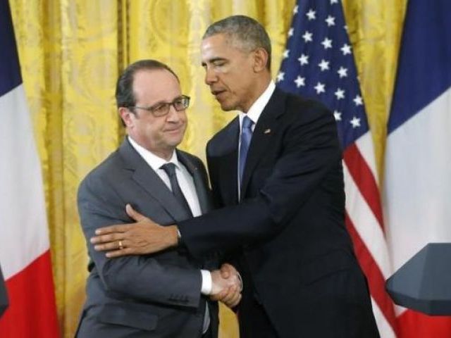 US President Barack Obama greets French President Francois Hollande during a joint news