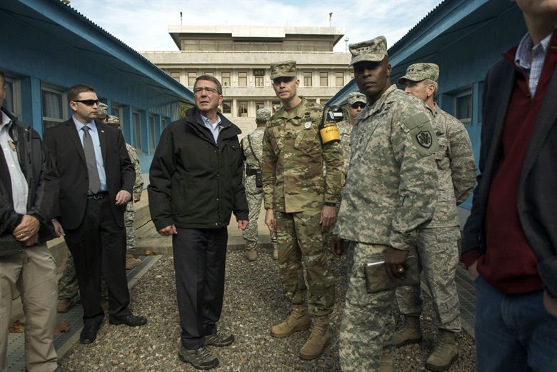 Defense Secretary Ash Carter speaks with U.S. Army Col. James Minnich Secretary of the United Nations Command Military Armistice Commission as he visits the Demilitarized Zone in the Republic of Korea Nov. 1 2015. Carter is visiting the Asia Pacific