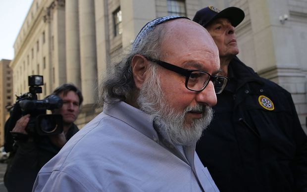 Former US Navy intelligence analyst Jonathan Pollard who spied for Israel leaves a New York court house after his release from prison early on Friday after 30 years