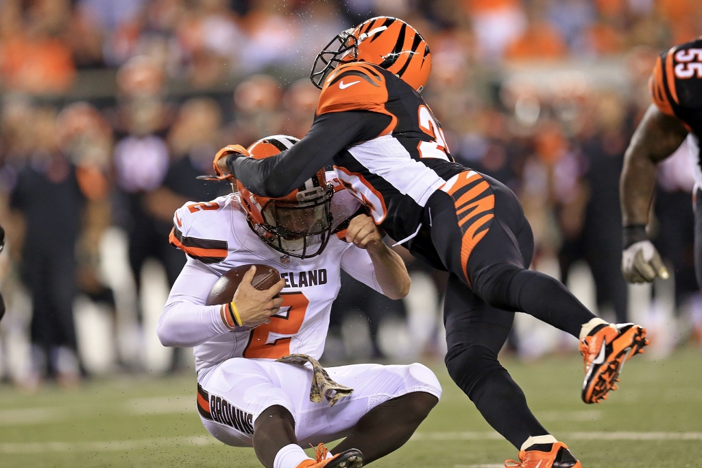 CINCINNATI OH- NOVEMBER 5 Leon Hall #29 of the Cincinnati Bengals tackles Johnny Manziel #2 of the Cleveland Browns during the third quarter at Paul Brown Stadium