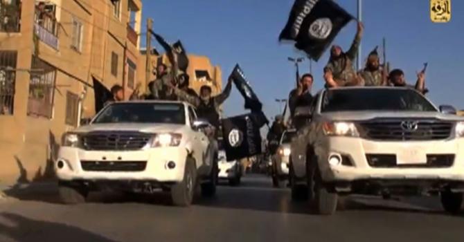 Islamic State jihadists are purportedly parading through the Syrian city of Raqa in video images from July 2014