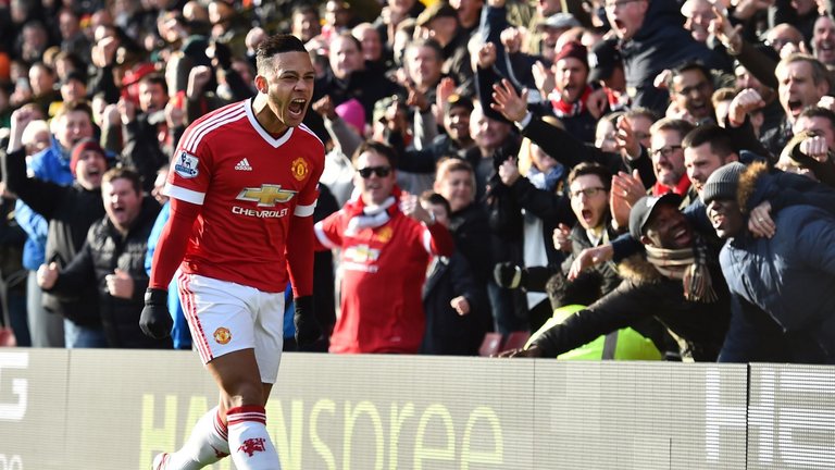 United's Memphis Depay celebrates scoring the opening goal against Watford