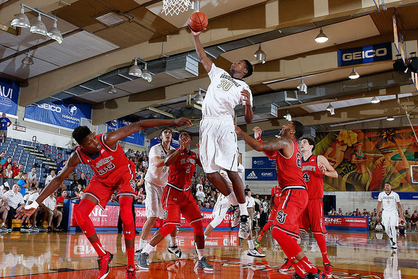 Vanderbilt Commodores center Damian Jones grabs a rebound against St. John´s Red Storm center Yankuba Sima at the Lahaina Civic Center during the Maui Jim Maui Invitational at the Lahaina Civic Center