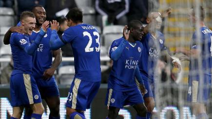 Jamie Vardy left celebrates with his team-mates after scoring for the 10th game in a row