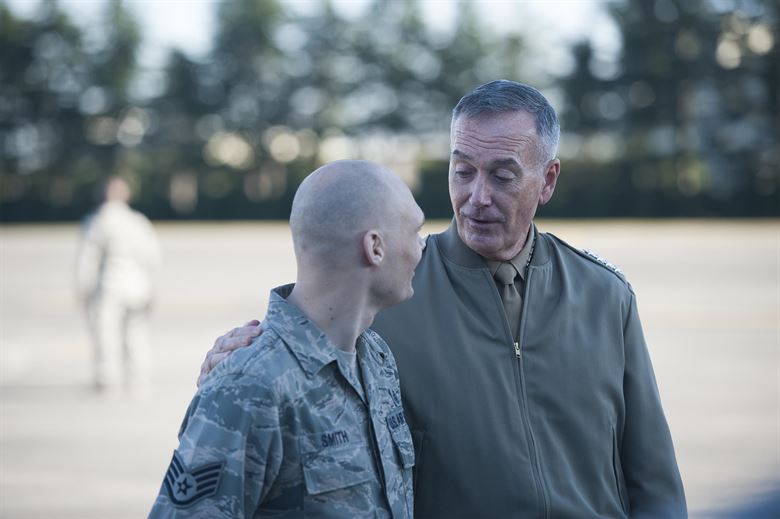 U.S. Marine Corps Gen. Joseph F. Dunford Jr. right chairman of the Joint Chiefs of Staff has a meet and greet with airmen assigned the 374th Airlift Wing on Yokota Air Base Japan Nov. 4 2015. DoD