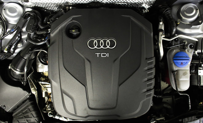 The sign of German car company Audi is attached on the engine of a TDI a turbo diesel model in Berlin Germany Monday Sept. 28 2015. Volkswagen AG's upmarket Audi brand said 2.1 million of its vehicles are among those with the engines affected by the