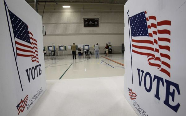 Voters cast their ballots in Orange High School