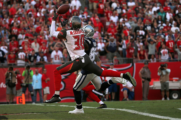 Dez Bryant #88 of the Dallas Cowboys Bradley Mc Dougald #30 of the Tampa Bay Buccaneers