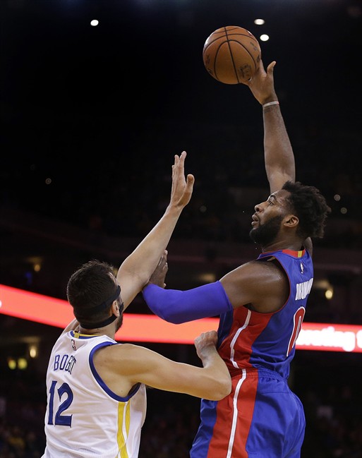 Detroit Pistons Andre Drummond right shoots over Golden State Warriors Andrew Bogut during the first half of an NBA basketball game Monday Nov. 9 2015 in Oakland Calif