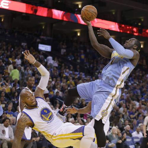 J.J. Hickson right shoots over Golden State Warriors&#039 Marreese Speights during the first half of an NBA basketball game Friday Nov. 6 2015 in Oakland Calif