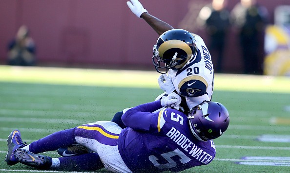 MINNEAPOLIS MN- NOVEMBER 8 Lamarcus Joyner #20 of the St. Louis Rams elbows Teddy Bridgewater #5 of the Minnesota Vikings taking Bridgewater out of the game