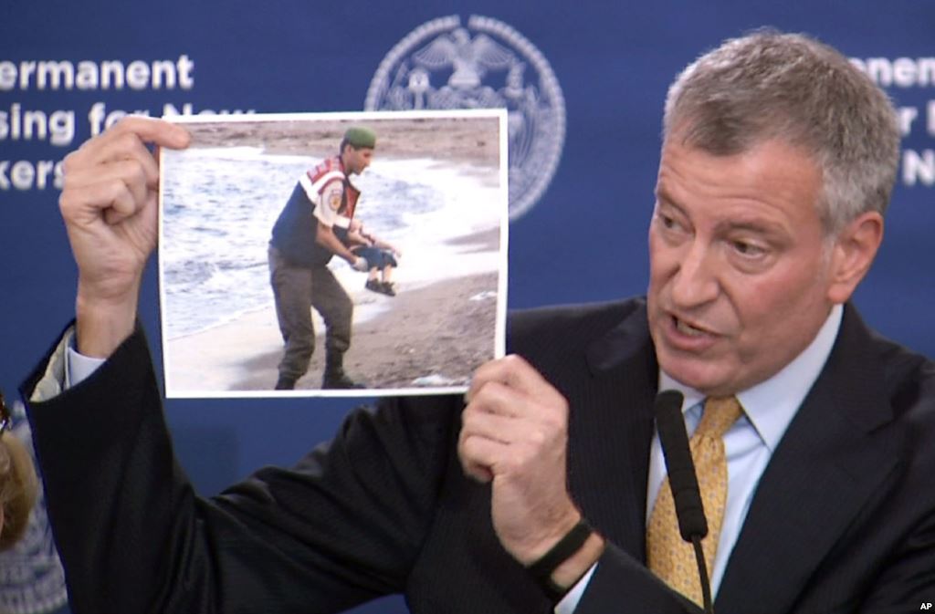 In this Nov. 18 2015 frame from video New York City Mayor Bill de Blasio displays