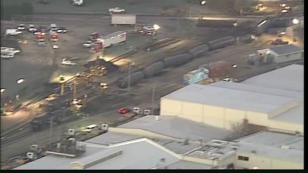 Train cars lie overturned outside of Alma Wis. after derailing on Saturday Nov. 7 2015. BNSF Railway said multiple tanker cars leaked ethanol into the Mississippi River on Saturday