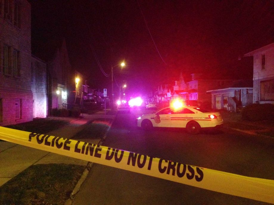 Police block off an area after a fatal shooting on Monday Nov. 23 2015 in Columbus Ohio. The suspect was shot by officers after a short chase outside the house where the shootings happened Columbus police said