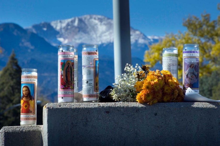 Pikes Peak forms a backdrop Monday Nov. 2 2015 for a memorial to the victims of Saturday's shootings in downtown Colorado Springs Colo. The man who fatally shot three people during a rampage through the streets of Colorado Springs was a recovering alc