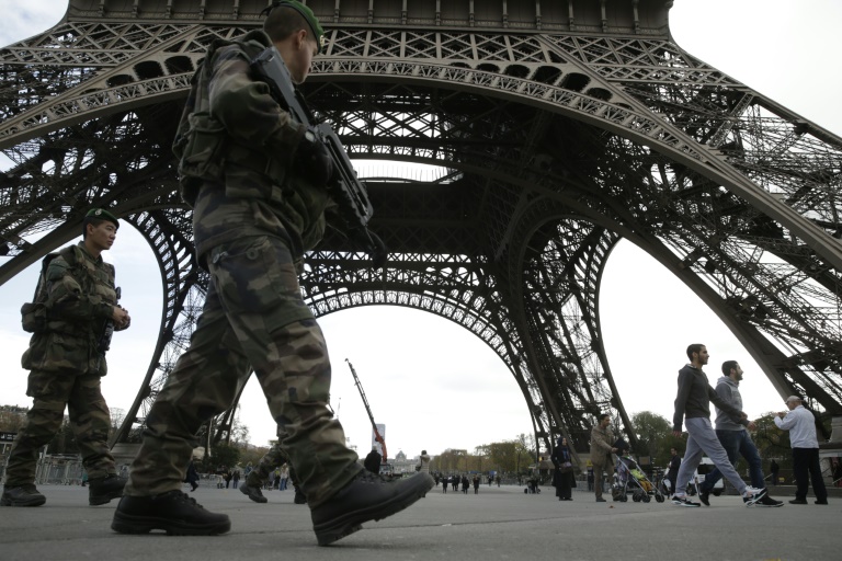 AFP  File  Kenzo Tribouillard Soldiers patrol at the foot of the Eiffel Tower in Paris