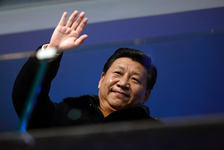 Chinese President Xi Jinping waves at the Winter Olympics opening ceremony in Sochi