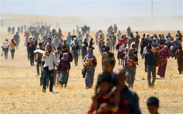 Yazidis flee ISIL's onslaught on Sinjar in August 2014