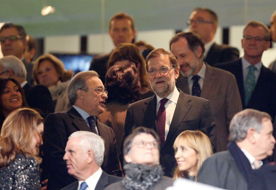 Real Madrid's presidente Florentino Perez center left talks with Spanish Prime Minister Mariano Rajoy before the first clasico of the season between Real Madrid and Barcelona at the Santiago Bernabeu stadium in Madrid Spain Saturday Nov. 21 2015. Ph