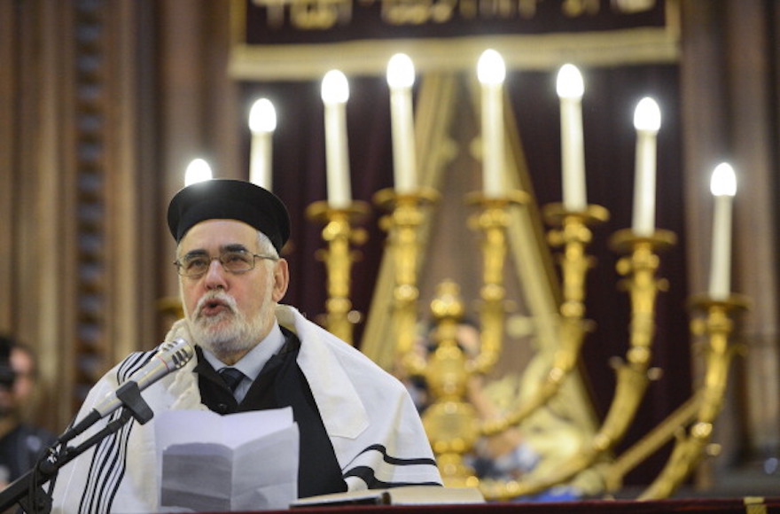 Brussels Grand Rabbi Albert Guigui speaking during a ceremony at Brussels Great Synagogue following the