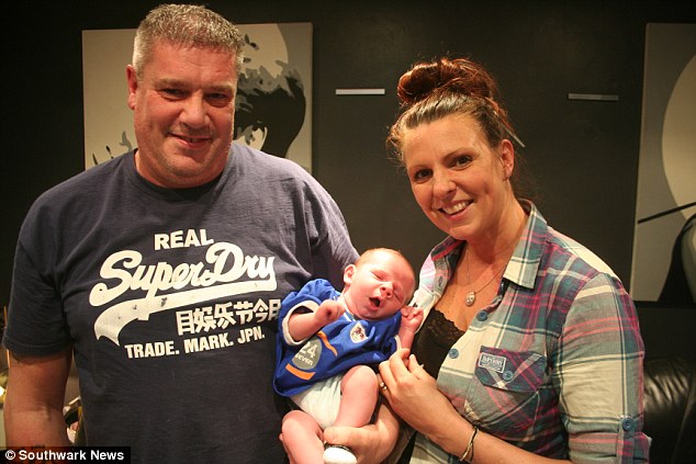 Proud parents Mike 58 and Kellie Bloomfield 38 with their newborn son Bermondsey Millwall Den- who has been named after the area of South East London the League One football club and their ground The New