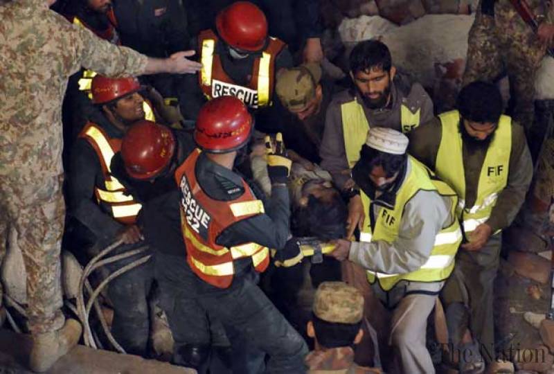 Pakistan factory collapse: At least 10 dead and dozens trapped after roof