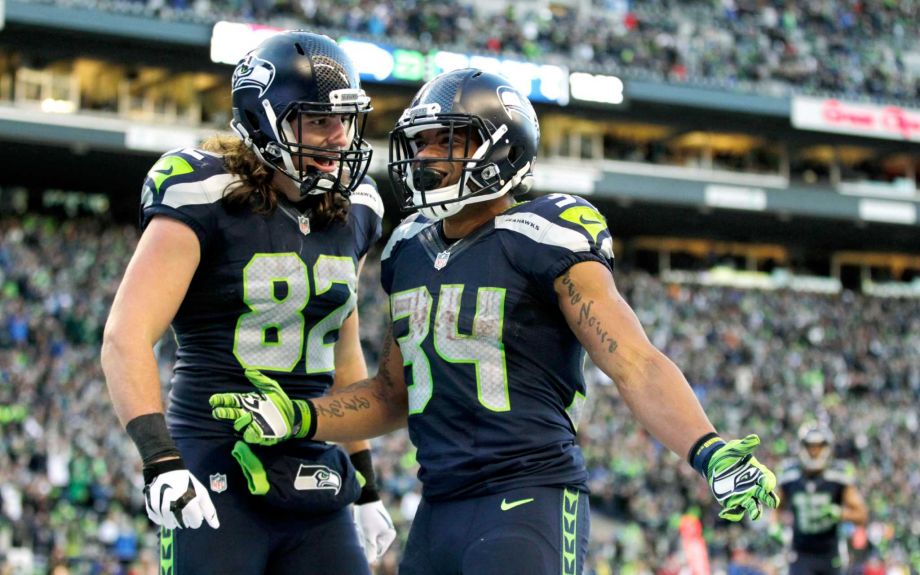 Seattle Seahawks running back Thomas Rawls celebrates with teammate tight end Luke Willson after Rawls scored a touchdown against the San Francisco 49ers in the second half of an NFL football game Sunday Nov. 22 2015 in Seattle