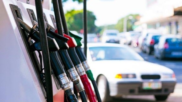 Car pulling up to gas pumps