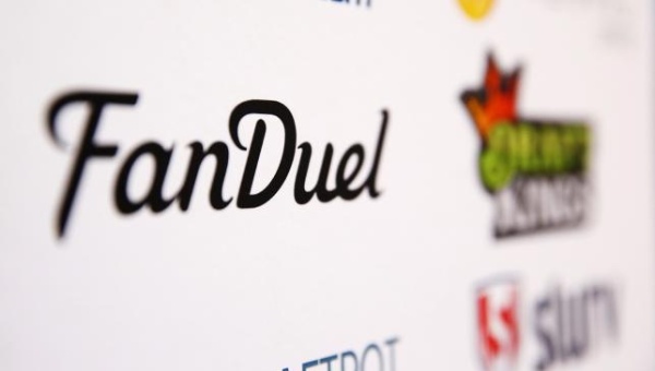 A Fan Duel logo is displayed on a board inside of the DFS Players Conference in New York