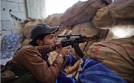 A YPG fighter takes position against ISIS militants in Syria. AFP file