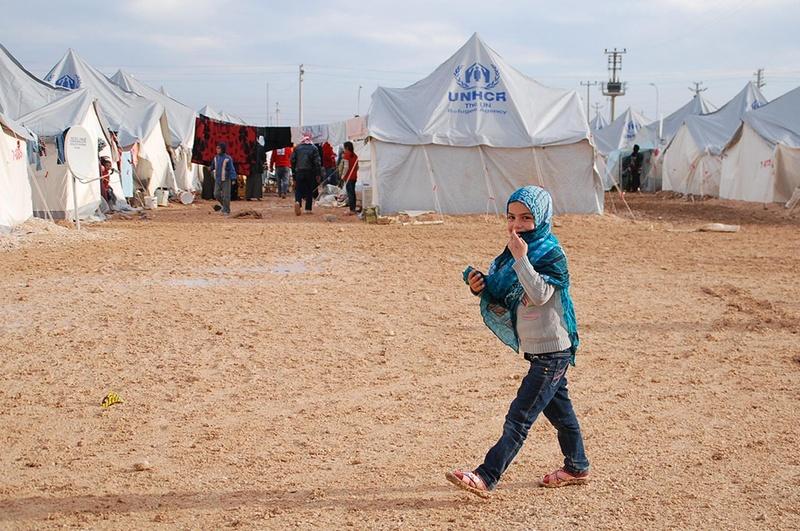 A child walks in a United Nations refugee camp in Turkey where thousands of Syrian refugees reside