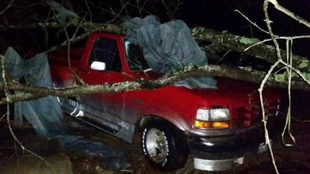 A fallen tree hit a pick-up truck in Holly Springs Mississippi after a storm struck the town