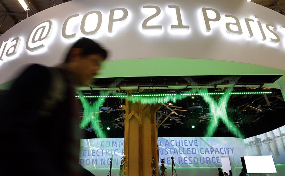 A man walks past the Indian Pavilion at the COP21 United Nations Climate Change Conference in Paris Monday. Pic AP