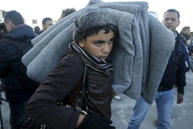 A migrant arrives aboard the passenger ferry Eleftherios Venizelos from the island of Lesbos Greece